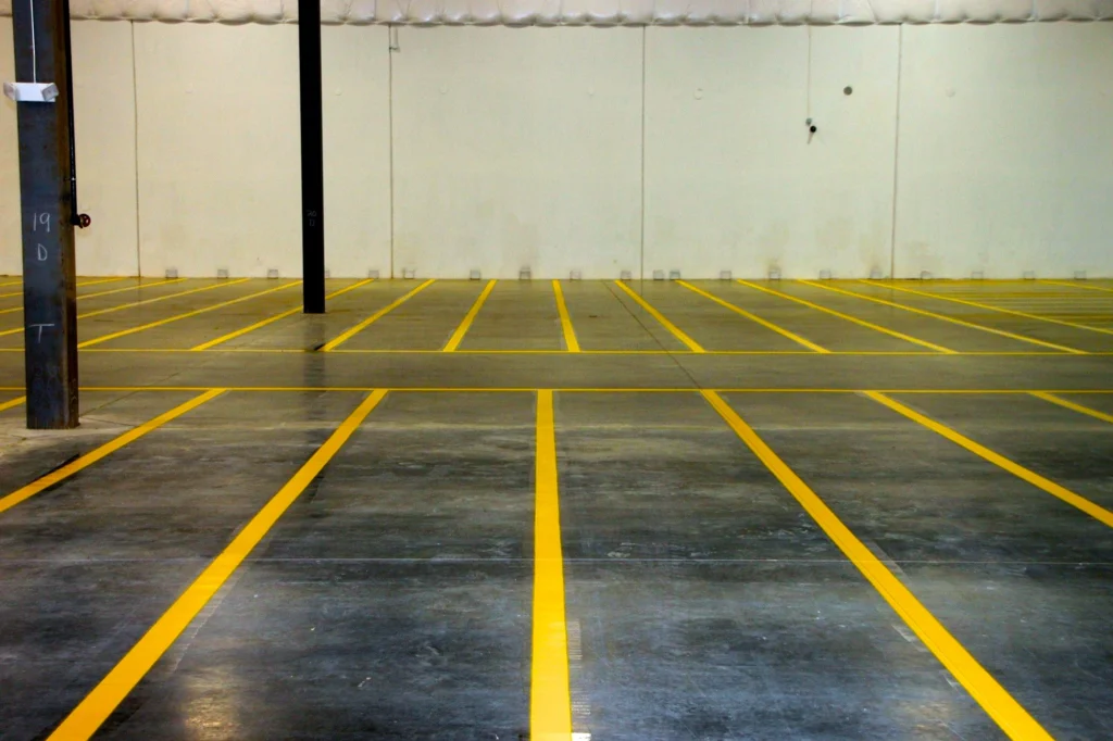 The inside of a warehouse with newly painted floor lines